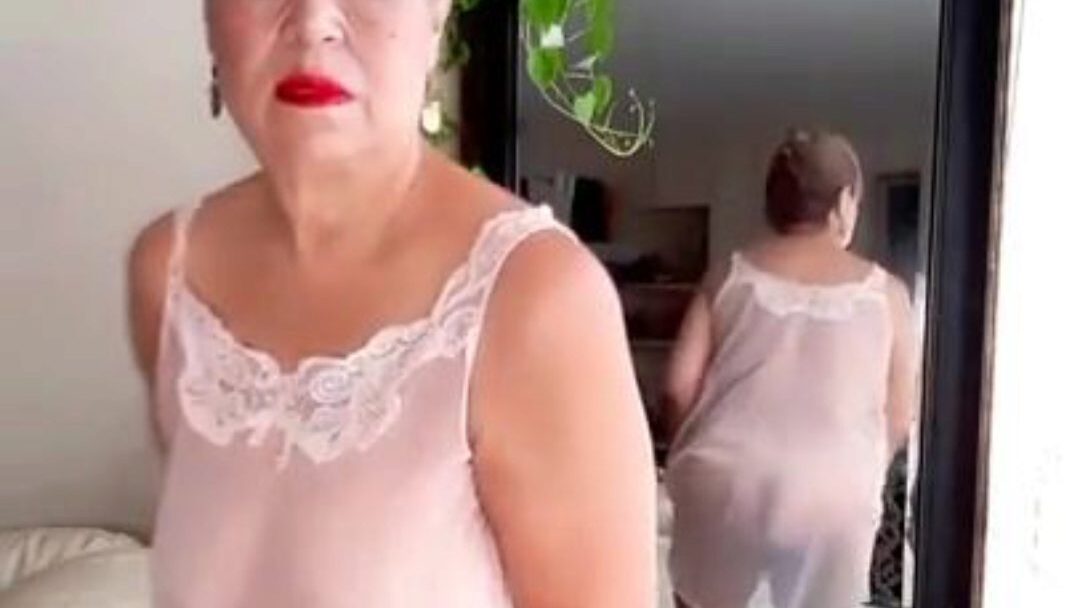 Mature plus-size female with bushy bawdy cleft wearing  sheer nightgown