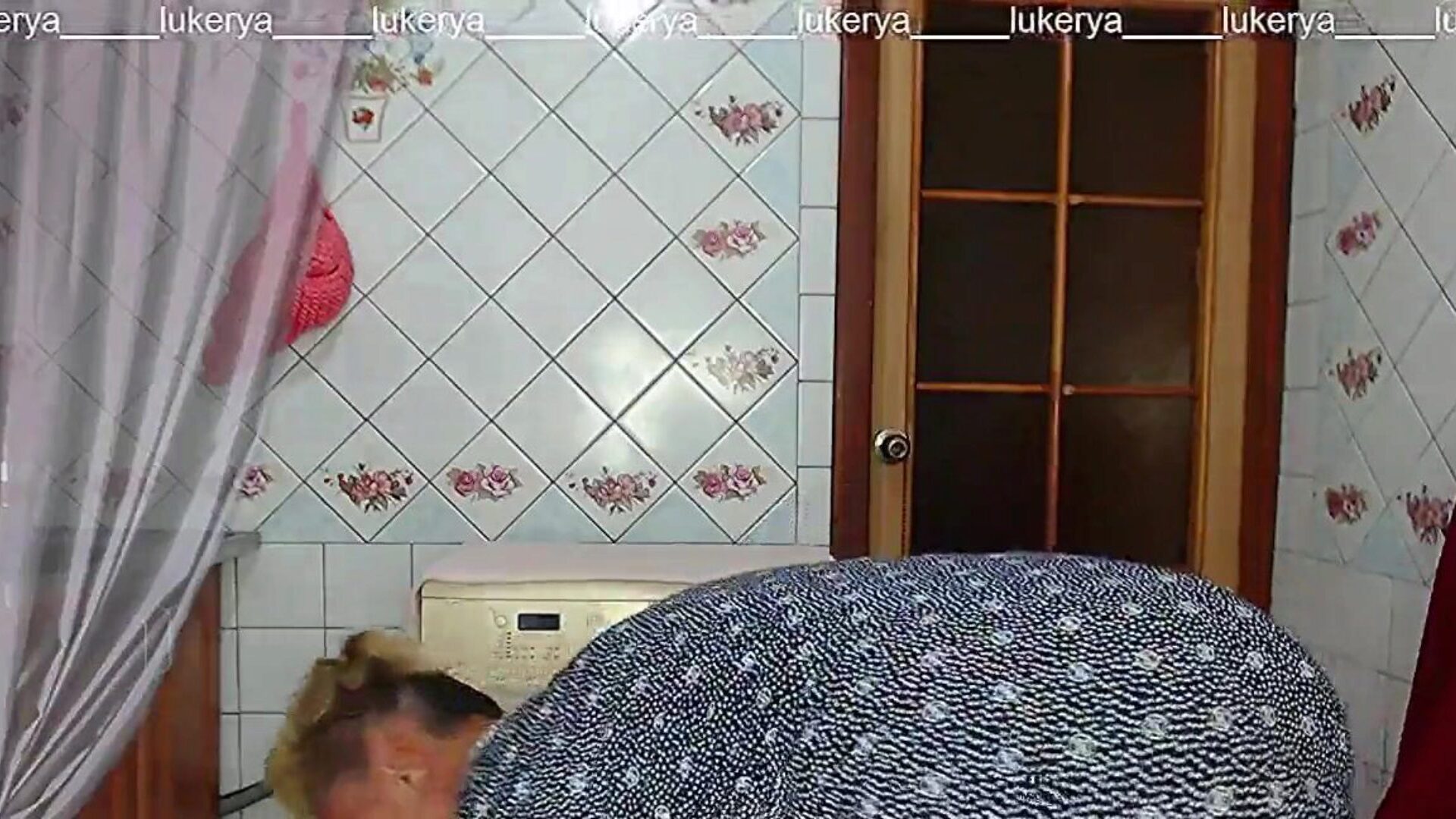 Lukerya in ebony fishnet nylons Lukerya wears african fishnet nylons that she has crocheted, erotic lingerie that enhances the beauty of her figure and guzzles coffee in the kitchen in front of the livecam